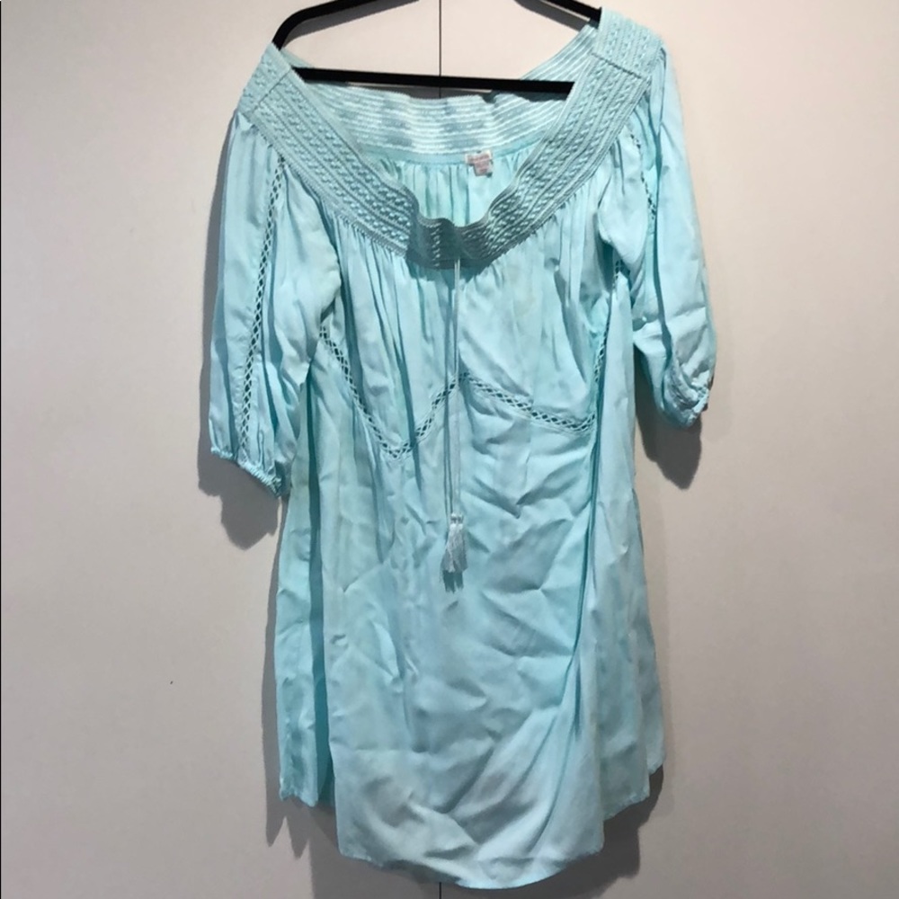 Beach cover up or dress or top.